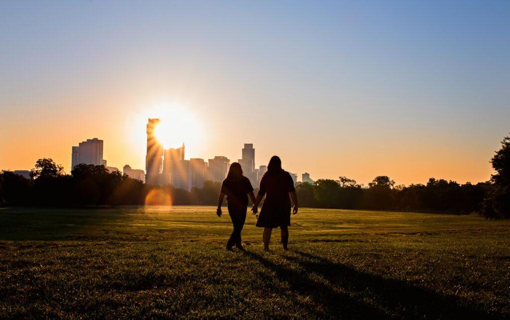 An LGBT couple taking a walk in downtown Austin