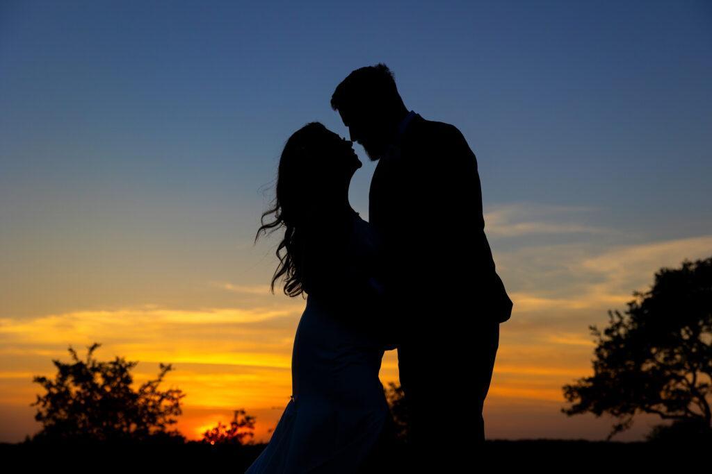 A sunset photo of a couple who had a small wedding in Austin